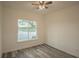 Bedroom with lake view and ceiling fan at 13055 Ne 7Th Loop, Silver Springs, FL 34488