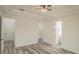 Spacious bedroom with hardwood floors and access to bathroom at 13055 Ne 7Th Loop, Silver Springs, FL 34488