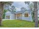 Charming house with gray siding and lake view at 13055 Ne 7Th Loop, Silver Springs, FL 34488