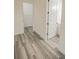 Hallway with light grey vinyl plank flooring at 13055 Ne 7Th Loop, Silver Springs, FL 34488