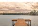 Serene view of a lake with a wooden dock at 13055 Ne 7Th Loop, Silver Springs, FL 34488