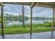 Serene view of the lake from under the house at 13055 Ne 7Th Loop, Silver Springs, FL 34488