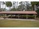 Community pavilion with picnic tables and grill at 13055 Ne 7Th Loop, Silver Springs, FL 34488