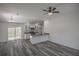 Modern kitchen featuring white shaker cabinets, stainless steel appliances, and gray countertops at 13099 Ne 7 Loop, Silver Springs, FL 34488