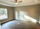 Spacious bedroom with large window and gray vinyl flooring at 13380 Se 43Rd Ave, Belleview, FL 34420