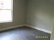 Spacious bedroom with grey vinyl plank flooring at 13380 Se 43Rd Ave, Belleview, FL 34420