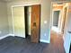 Bedroom with double door closet and gray vinyl flooring at 13380 Se 43Rd Ave, Belleview, FL 34420