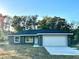 Newly constructed home with gray exterior and a two-car garage at 13380 Se 43Rd Ave, Belleview, FL 34420