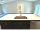 Kitchen island with quartz countertop and stainless steel sink at 13380 Se 43Rd Ave, Belleview, FL 34420