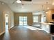 Spacious living room with vinyl plank flooring and sliding glass doors at 13380 Se 43Rd Ave, Belleview, FL 34420