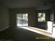 Bright living room featuring sliding glass doors at 13380 Se 43Rd Ave, Belleview, FL 34420