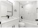 Modern bathroom with white vanity and marble tile at 14363 Se 36Th Ct, Summerfield, FL 34491