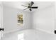 Bright bedroom with window and marble floors at 14363 Se 36Th Ct, Summerfield, FL 34491