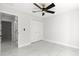 Well-lit bedroom with double doors and marble floors at 14363 Se 36Th Ct, Summerfield, FL 34491