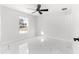 Spacious bedroom with large window and tile flooring at 14363 Se 36Th Ct, Summerfield, FL 34491