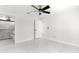 Bright bedroom with ceiling fan and access to bathroom at 14363 Se 36Th Ct, Summerfield, FL 34491