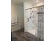 Bathroom with shower and wood-look floor at 15155 Sw 52 Cir, Ocala, FL 34473