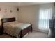 Bright bedroom with double bed and carpeted floor at 15155 Sw 52 Cir, Ocala, FL 34473