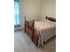 Bedroom with a wooden bed frame and carpeted floor at 15155 Sw 52 Cir, Ocala, FL 34473