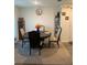 Dark wood dining set with four chairs in a carpeted dining area at 15155 Sw 52 Cir, Ocala, FL 34473