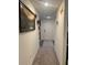 Long hallway with light walls and carpeted floor at 15155 Sw 52 Cir, Ocala, FL 34473