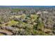 Aerial view of property showing house, pond, and land at 15315 Nw 115Th Ct, Reddick, FL 32686