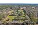 Aerial view of property showing house, pond, and land at 15315 Nw 115Th Ct, Reddick, FL 32686