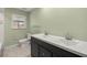 Bathroom with double vanity and tile flooring at 15315 Nw 115Th Ct, Reddick, FL 32686