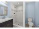 Updated bathroom with shower and dark vanity at 15315 Nw 115Th Ct, Reddick, FL 32686