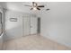 Bright bedroom with tile floors and double-door closet at 15315 Nw 115Th Ct, Reddick, FL 32686