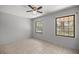 Bedroom with tile floors and two windows at 15315 Nw 115Th Ct, Reddick, FL 32686