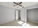 Well-lit bedroom with tile floors and a closet at 15315 Nw 115Th Ct, Reddick, FL 32686