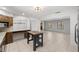 Bright dining room with tile floors and view into living room at 15315 Nw 115Th Ct, Reddick, FL 32686