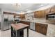 Spacious kitchen featuring stainless steel appliances and granite countertops at 15315 Nw 115Th Ct, Reddick, FL 32686