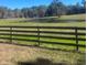 Pasture with pond and wooden fence at 15315 Nw 115Th Ct, Reddick, FL 32686