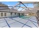 Inviting pool with covered patio and string lights at 15315 Nw 115Th Ct, Reddick, FL 32686