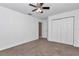 Bedroom with double door closet and carpeted floor at 18300 Sw 69 Loop, Dunnellon, FL 34432