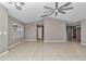 Spacious living room with tile flooring and ceiling fan at 18300 Sw 69 Loop, Dunnellon, FL 34432