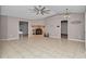 Spacious living room with tile floors, fireplace, and high ceilings at 18300 Sw 69 Loop, Dunnellon, FL 34432