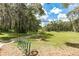 Landscaped park with a walking path and bike rack at 18300 Sw 69 Loop, Dunnellon, FL 34432