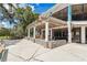 Outdoor patio area with pergola and stone wall at 18300 Sw 69 Loop, Dunnellon, FL 34432