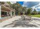 Outdoor patio area with tables, chairs, and a pergola at 18300 Sw 69 Loop, Dunnellon, FL 34432