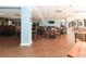 Restaurant with light blue walls, wood floors, and a bar at 18300 Sw 69 Loop, Dunnellon, FL 34432