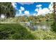 Boats on a calm river with lush green vegetation at 18300 Sw 69 Loop, Dunnellon, FL 34432