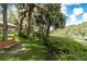 Park-like setting with a bench overlooking a river at 18300 Sw 69 Loop, Dunnellon, FL 34432