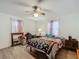 Cozy bedroom with wood floors and ceiling fan at 1910 Se 170Th Avenue Rd, Silver Springs, FL 34488