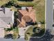 Overhead view showcasing the home's design and surrounding landscape at 1982 Somerset Ave, The Villages, FL 32162