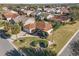 Bird's-eye view of the house, highlighting its curb appeal and landscaping at 1982 Somerset Ave, The Villages, FL 32162