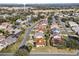 Aerial view of single Gathering home in a golf course community at 1982 Somerset Ave, The Villages, FL 32162