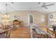 Spacious dining area with hardwood floors and a glass top table at 1982 Somerset Ave, The Villages, FL 32162